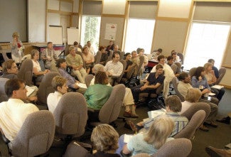 classroom of adults listening to a speaker